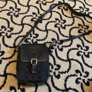 Black coach crossbody purse.